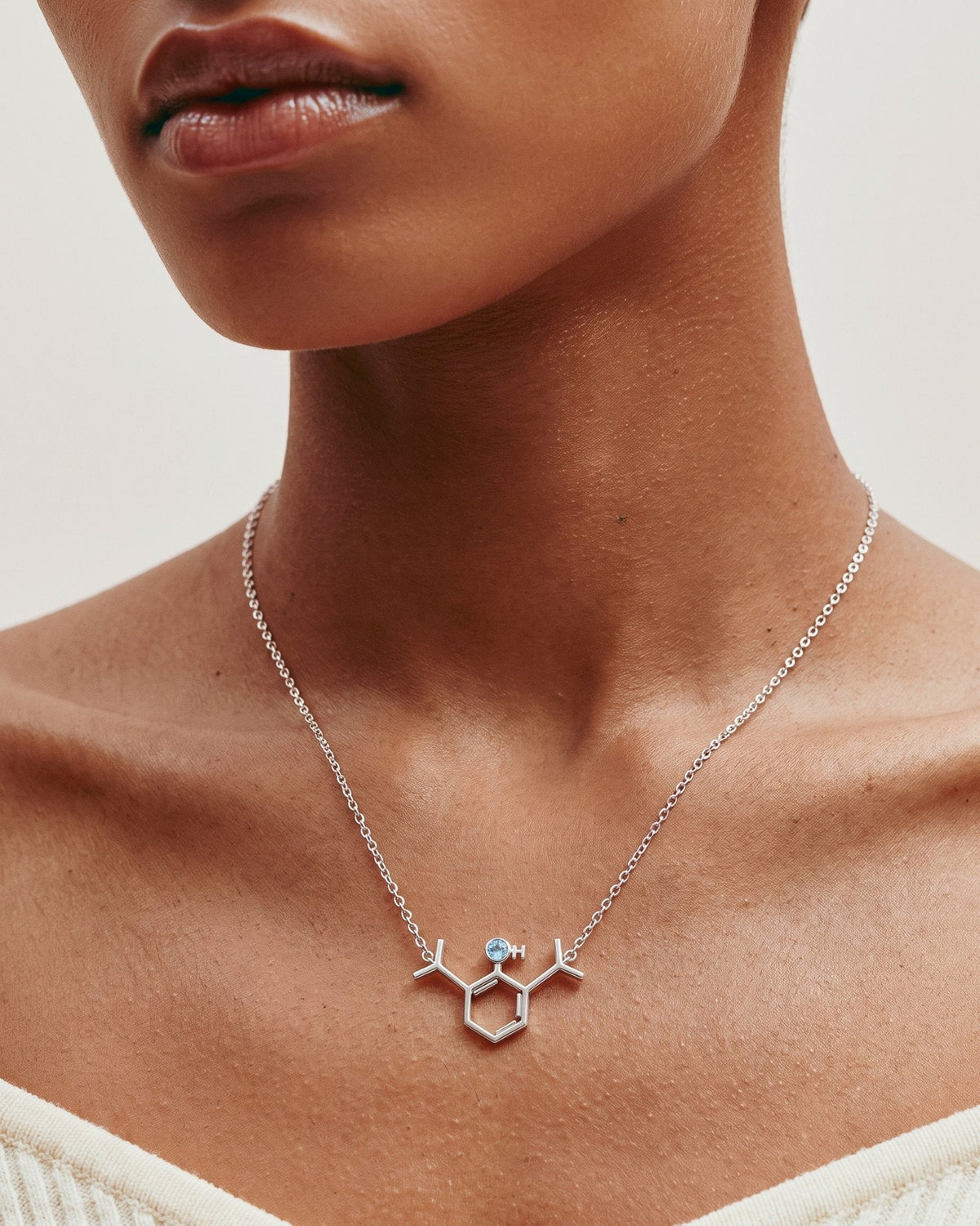 The Johanna sterling silver propofol molecule necklace with blue topaz by House of Rednam