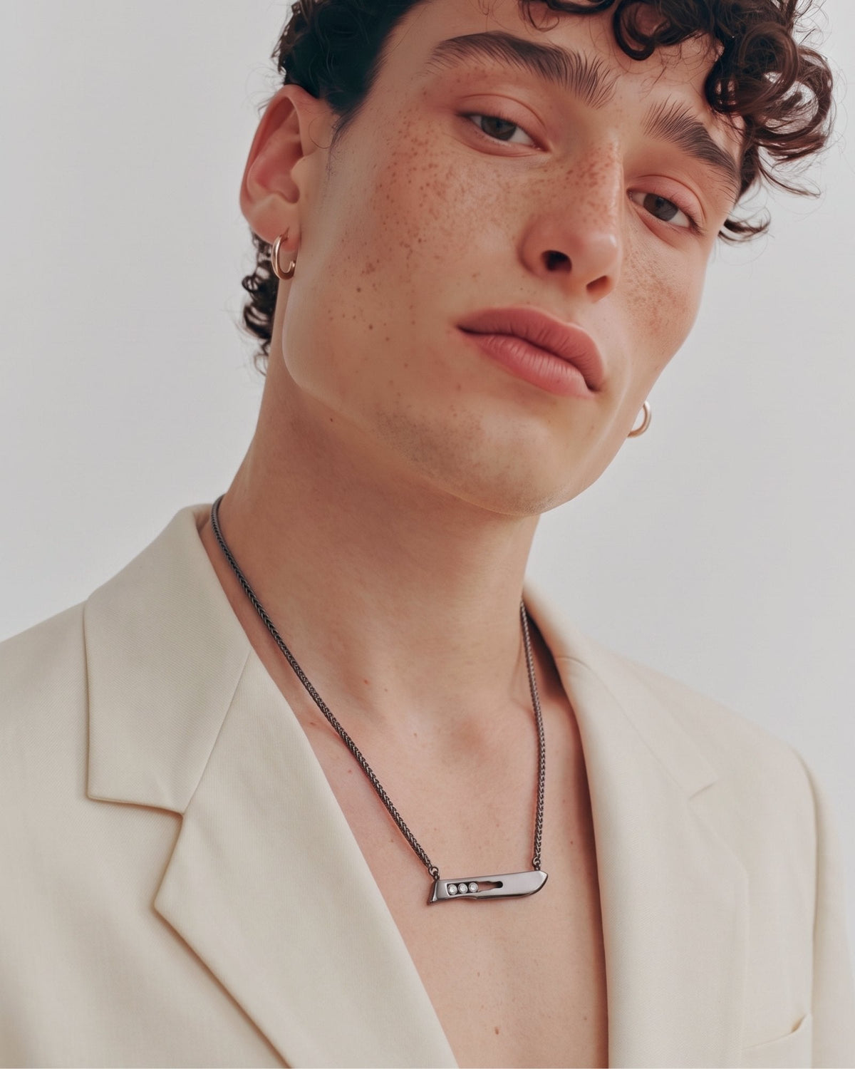 The Kiran No10 scalpel pendant in sterling silver with a black rhodium finish and three diamonds by House of Rednam, view 3